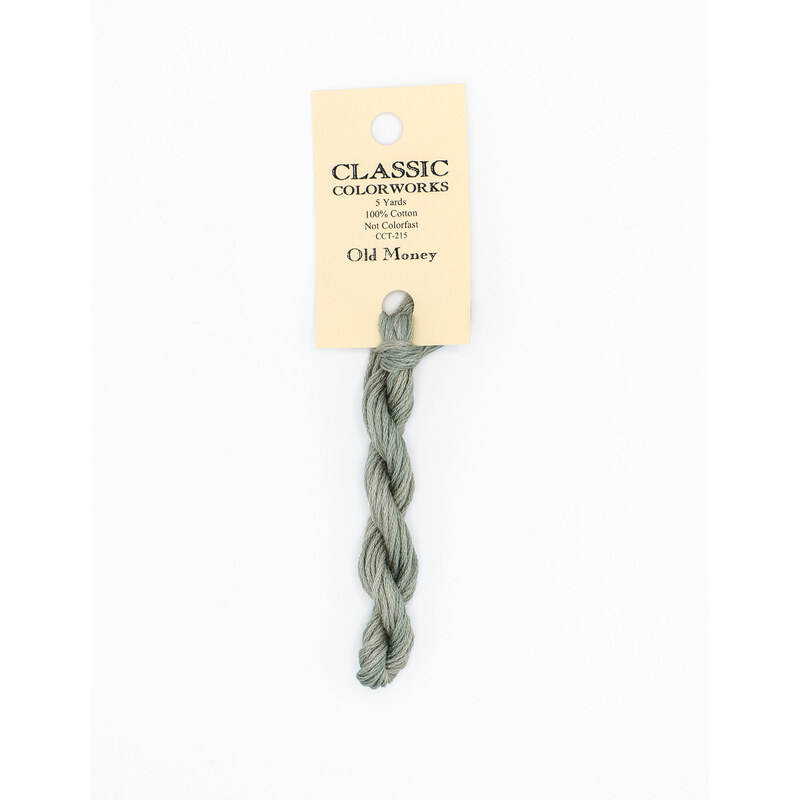 A skein of lemongrass green embroidery floss, twisted and bundled, with a cream and black label featuring the brand name and color information.