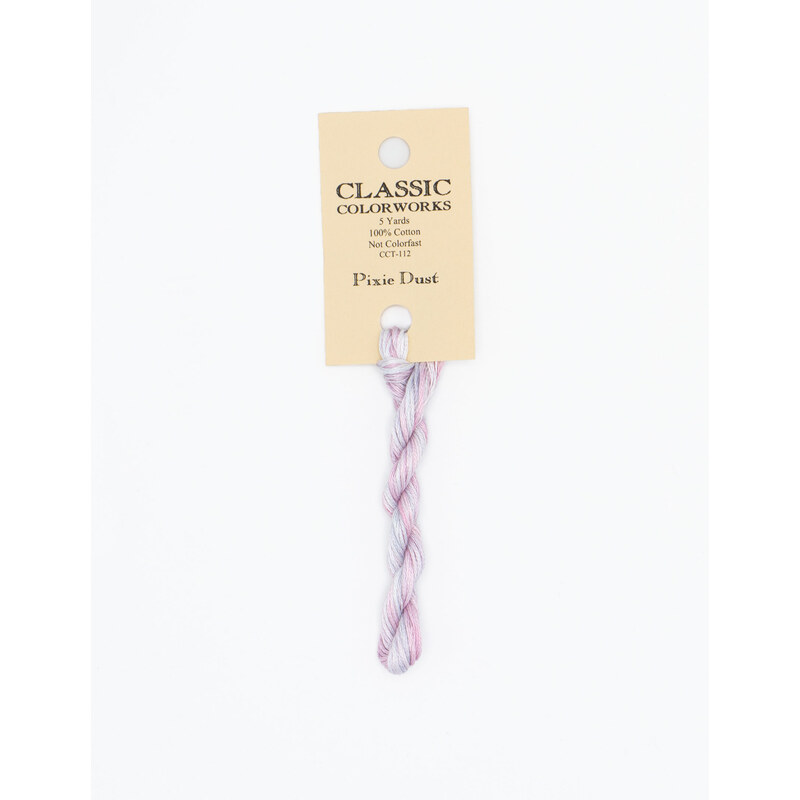 A skein of variegated pastel pink and purple embroidery floss, twisted and bundled, with a cream and black label featuring the brand name and color information.