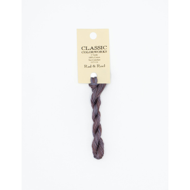 A skein of violet embroidery floss, twisted and bundled, with a cream and black label featuring the brand name and color information.