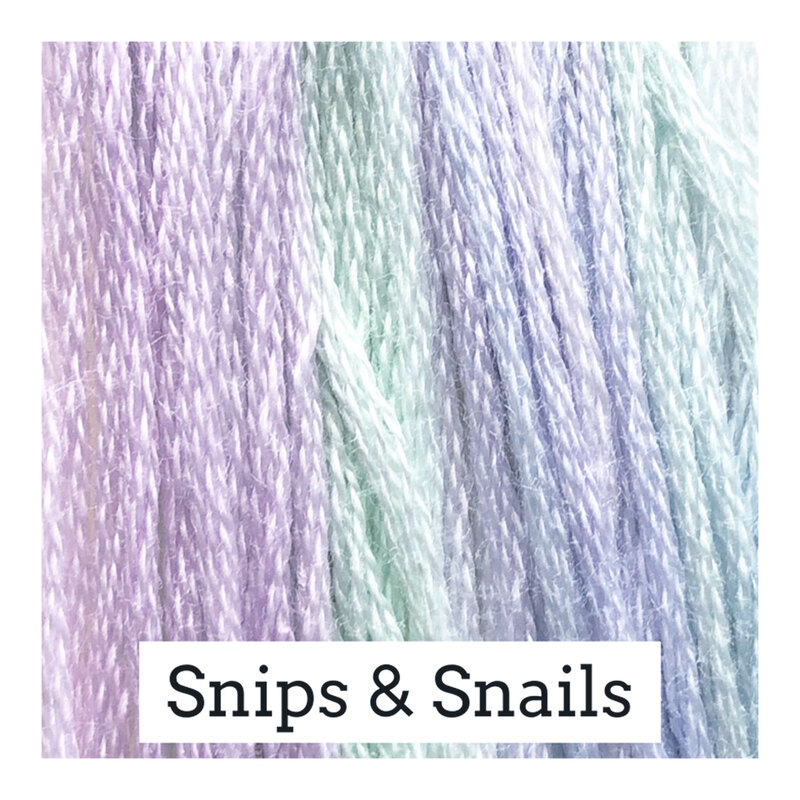 A variegated swatch of Classic Colorworks floss in the colors pastel blue, green, and purple.