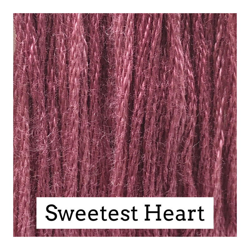 Swatch of mauve colored threads