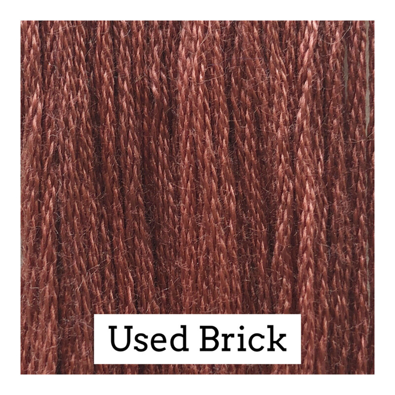 Swatch of brick red colored threads