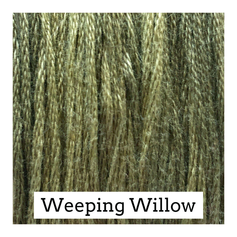 Swatch of tea green colored threads