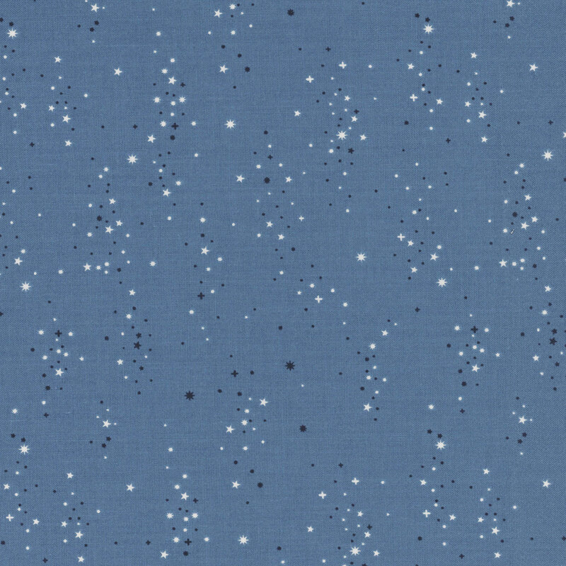 Denim blue fabric with a scattered pattern of small navy and white star clusters.