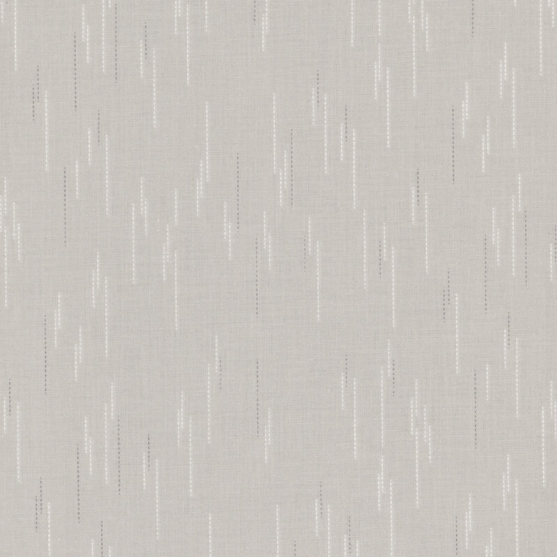 Gray fabric with a pattern of spaced apart dotted lines.