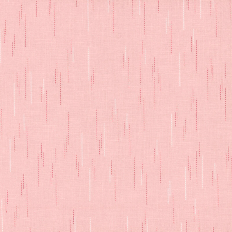 Pink fabric with a pattern of spaced apart dotted lines.