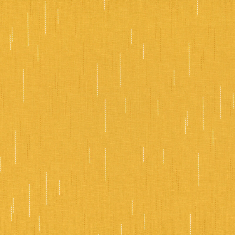 Golden yellow fabric with a pattern of spaced apart dotted lines.