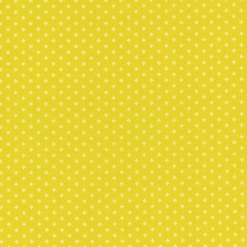 Citron green fabric is with a pattern of small, white, geometric diamond shapes. 