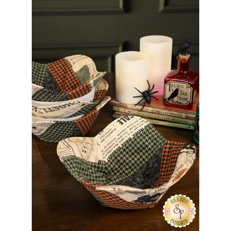 A completed bowl cozy with coordinating décor and the other bowl cozies in the background.