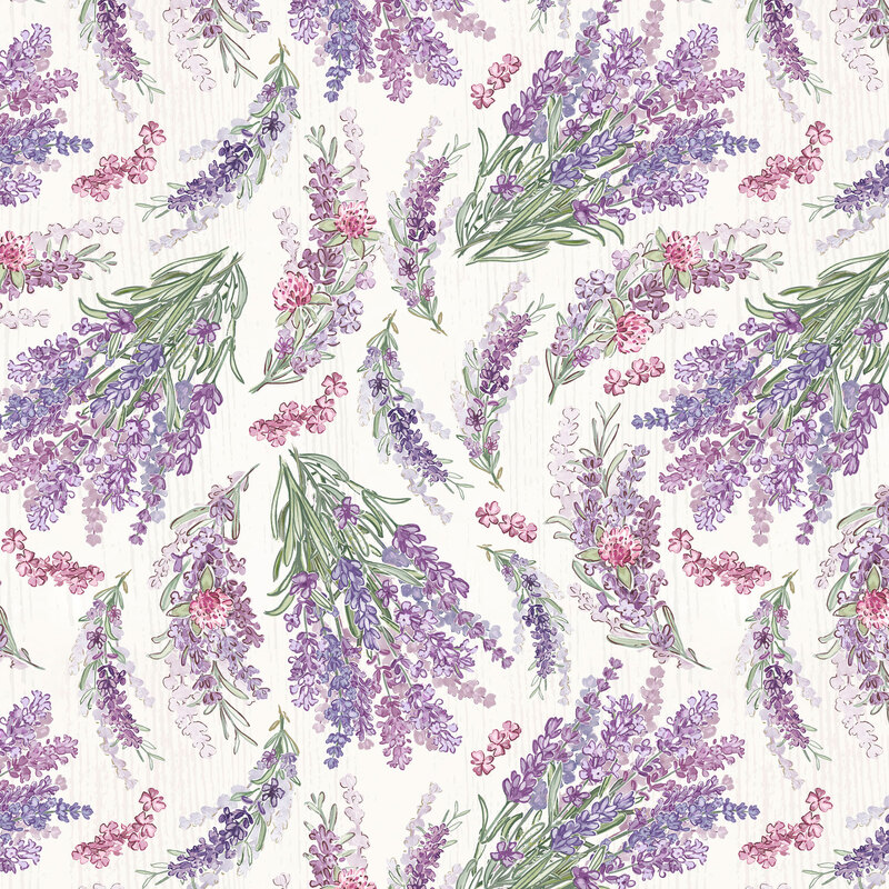 Bundles of fresh purple lavender scattered on a textured white background.