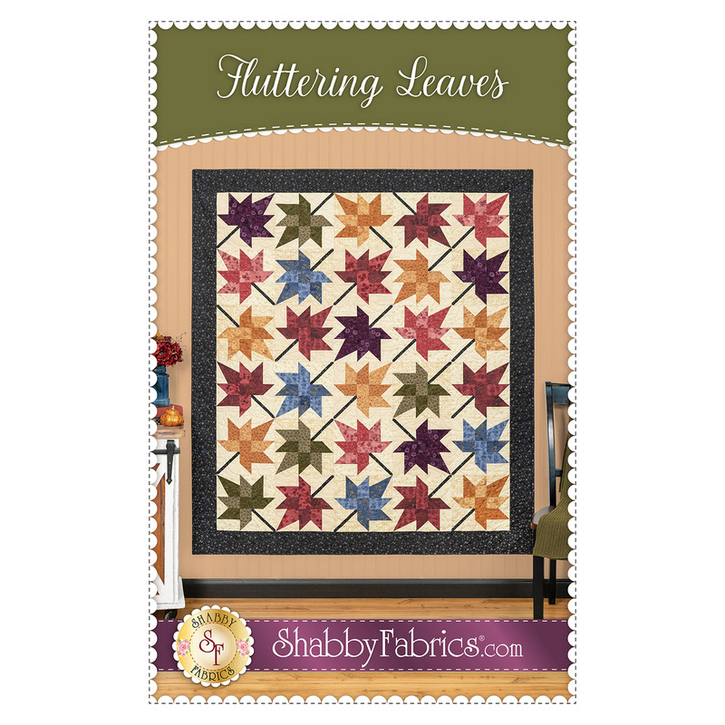 Front cover of the pattern featuring the completed quilt in calming earth tone colors, staged on a warm tan wall with coordinating decor.