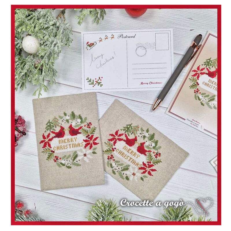 The completed project, a christmas card with two cardinals, staged with coordinating holiday decor.