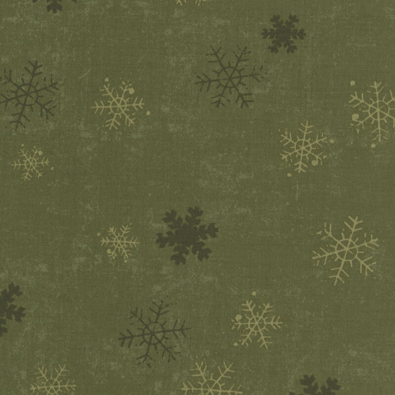 Moss green mottled fabric with light and dark green snowflakes.
