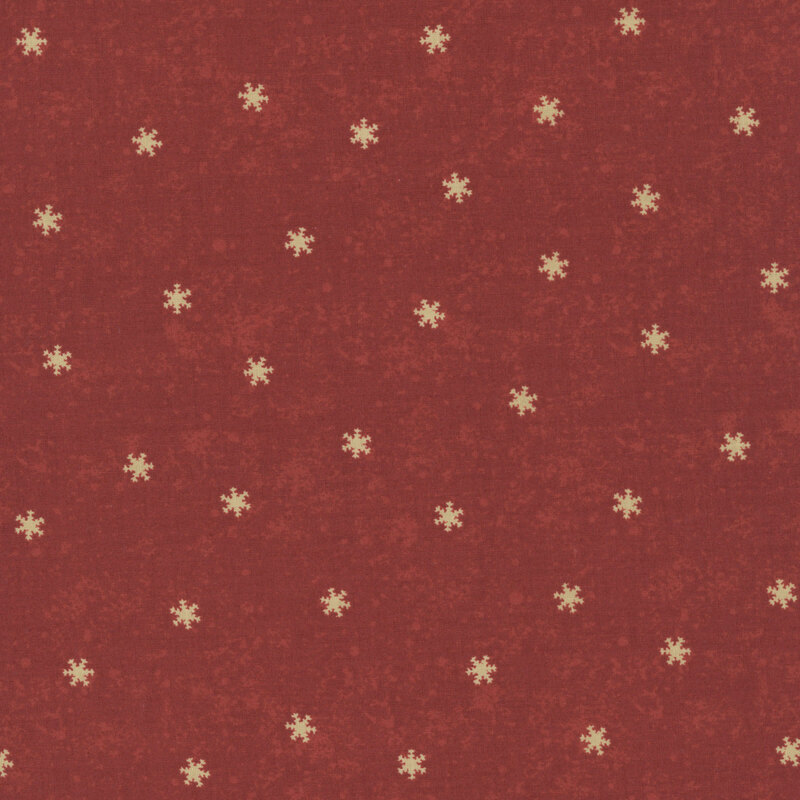 Crimson mottled fabric with scattered cream snowflakes