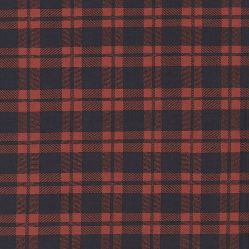 Crimson fabric with a black plaid pattern. 