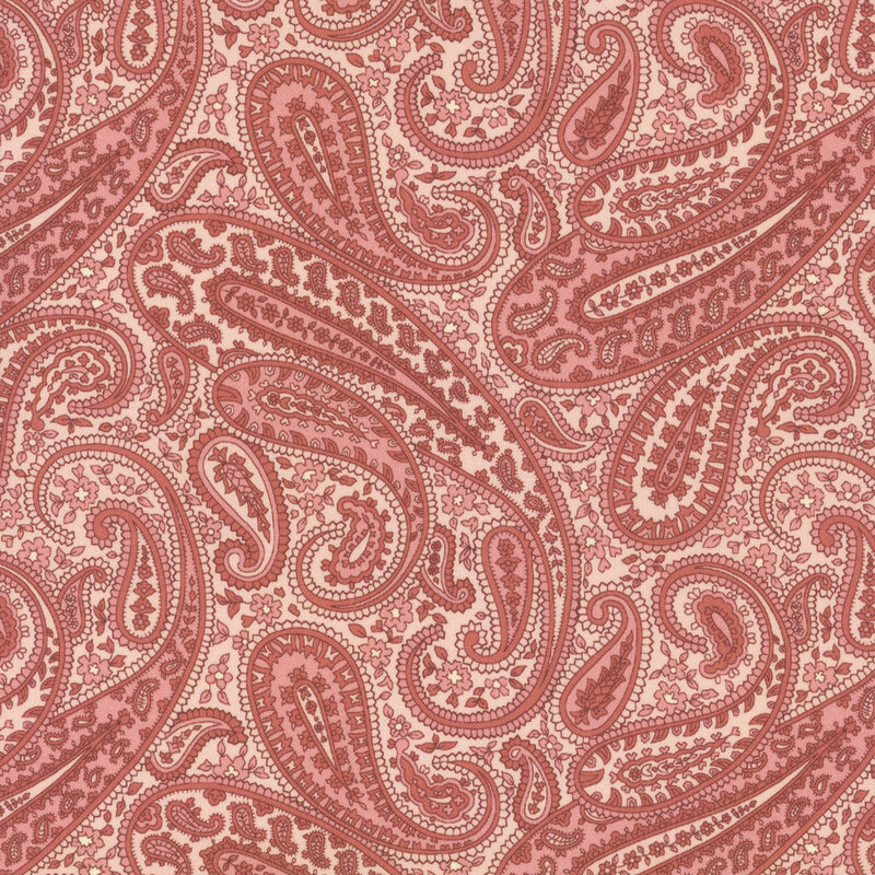 Light salmon fabric with a dark coral paisley design. 