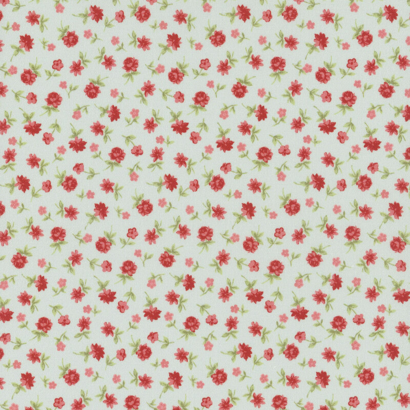 Light turquoise fabric with a calico pattern of coral red roses and pink flowers.