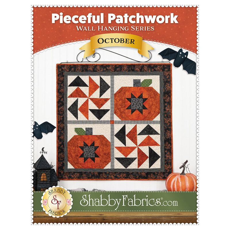 Front cover of the Pieceful Patchwork - October pattern, showing the completed wall hanging in cream, orange, and black fabrics, staged with coordinating Halloween decor.