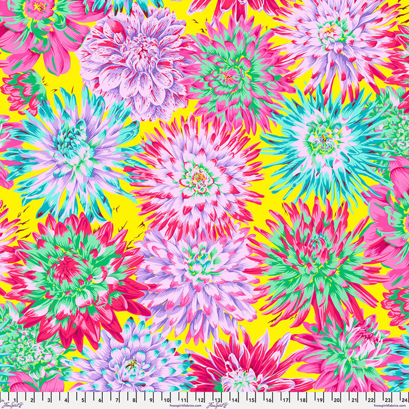 Brilliant yellow fabric with bright zinnias and chrysanthemums. 