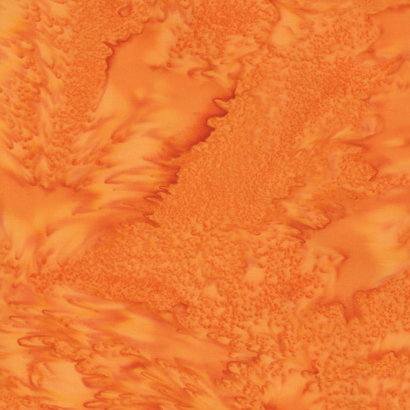 A pumpkin orange batik with tonal mottling.
