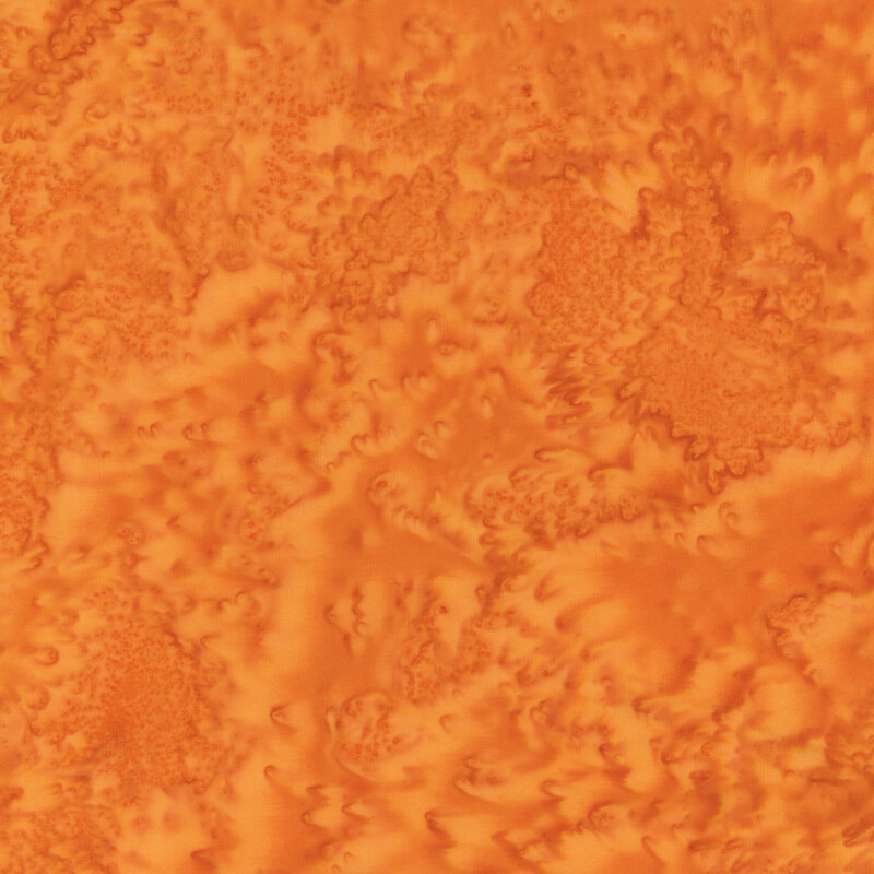 A pumpkin orange batik with tonal mottling.