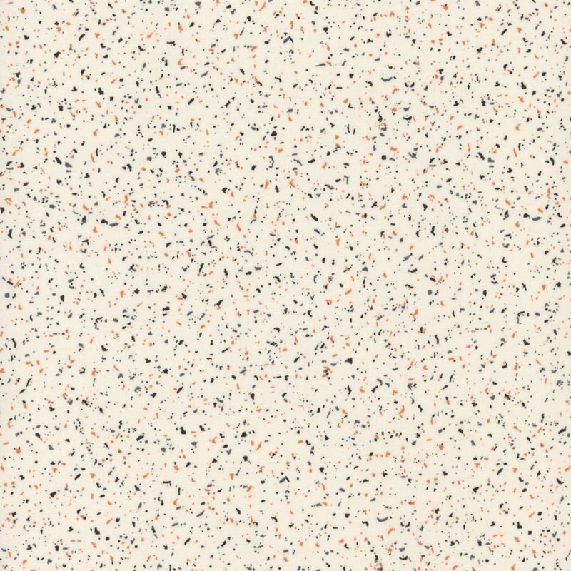 Cream fabric with scattered black and orange flecks.