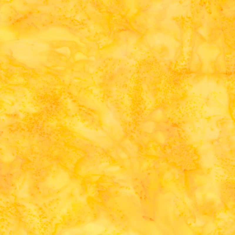 A yellow and gold mottled batik fabric with watercolor accents.