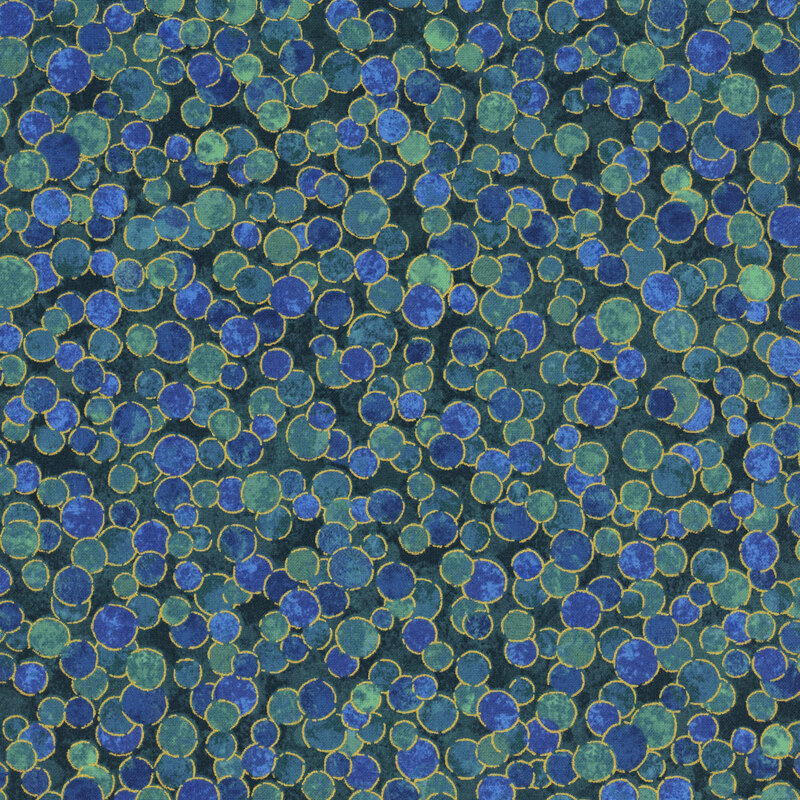 mottled aqua fabric featuring overlapping dots of navy and teal with gold metallic outlines.