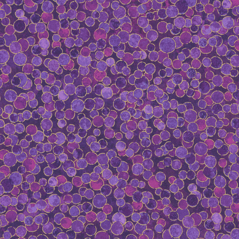 mottled dark violet fabric features overlapping orchid and lavender dots with gold metallic outlines.