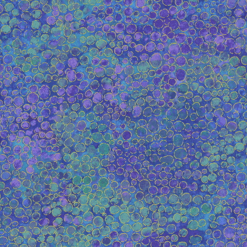 mottled ultramarine blue and teal fabric with an abstract paint-splatter effect and gold metallic accents.