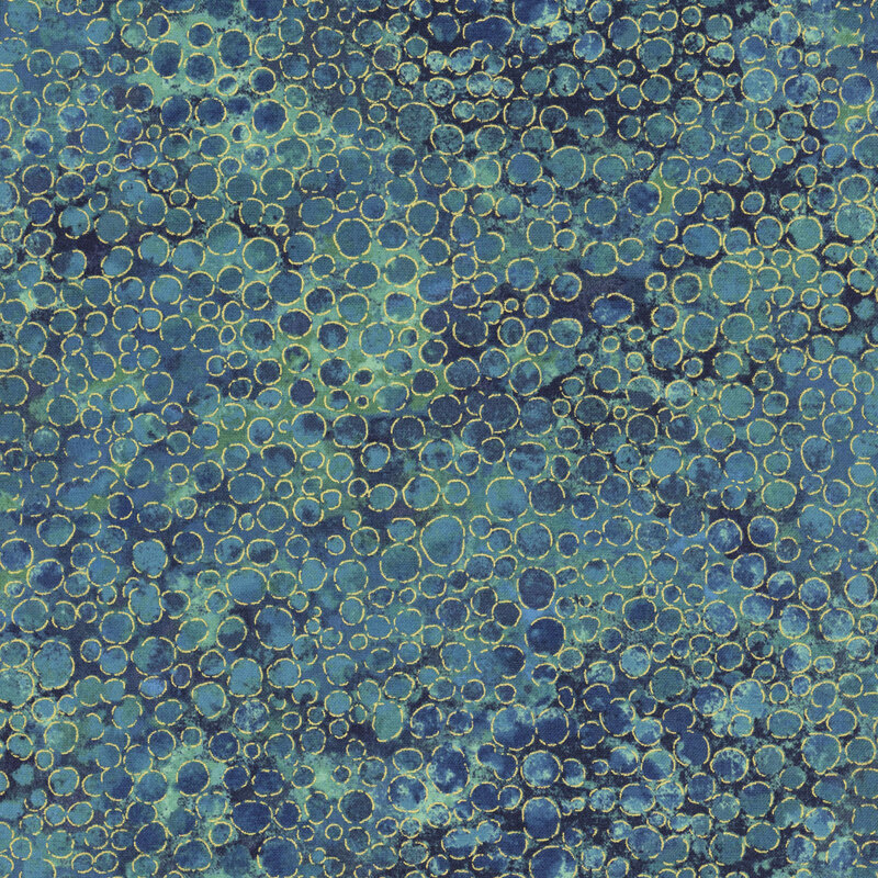 mottled dark blue and sage fabric with an abstract paint-splatter effect and gold metallic accents.