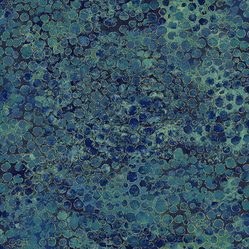 mottled dark blue and sage fabric with an abstract paint-splatter effect and gold metallic accents.