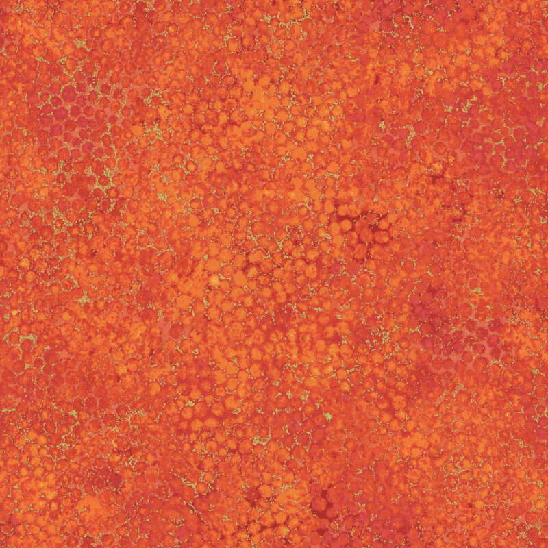 mottled rusty red fabric featuring a pitted texture pattern and gold metallic accents.
