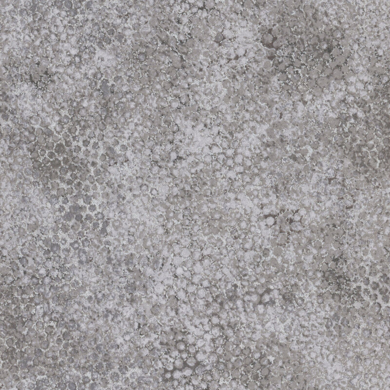 mottled slate gray fabric featuring a pitted texture pattern and silver metallic accents.