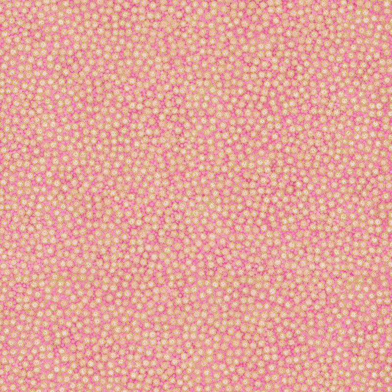 mottled pale pink fabric featuring dense, small dots with gold metallic outlines
