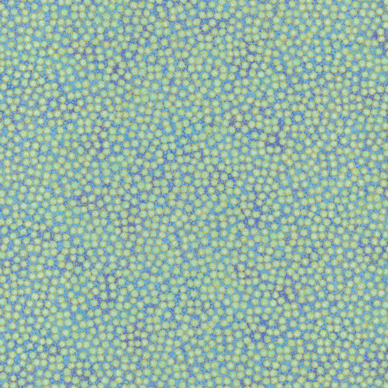mottled dark teal blue fabric featuring dense, small teal dots with gold metallic outlines
