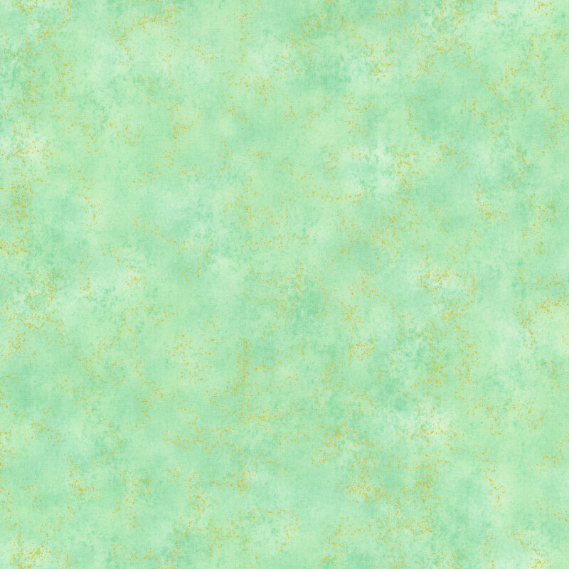 mottled green fabric with gold metallic flakes