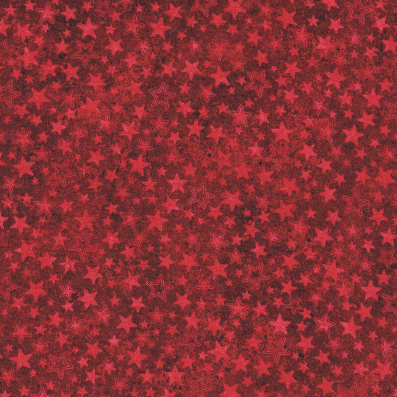 Red textured fabric with a pattern of scattered stars.