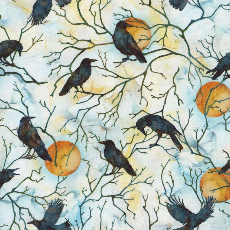 A white watercolor fabric with ravens, tree branches, and full moons. 