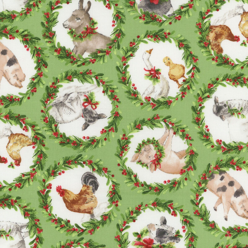 green fabric featuring farm animals inside wreaths made of holly