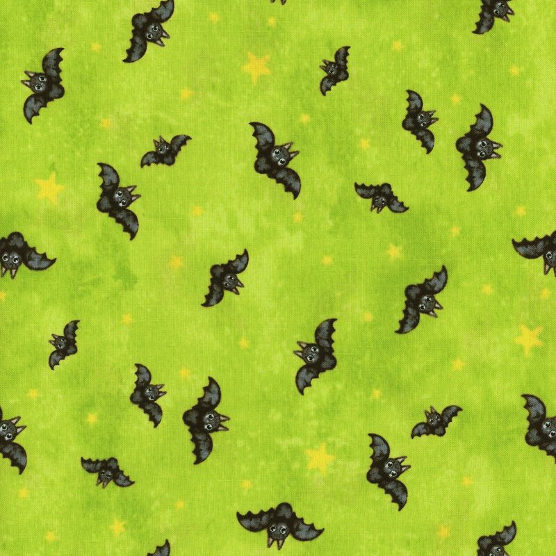 lime green fabric featuring black bats flying amongst yellow stars