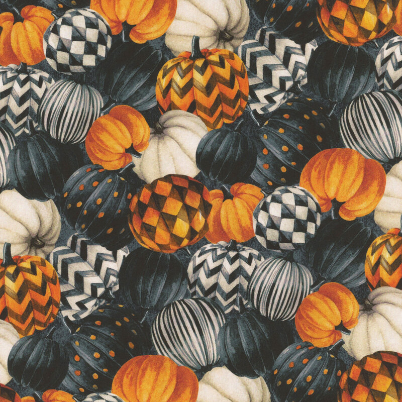 Painted pumpkins in gold, black, and white of dots, zigzags, checkers packed on a mottled black background.