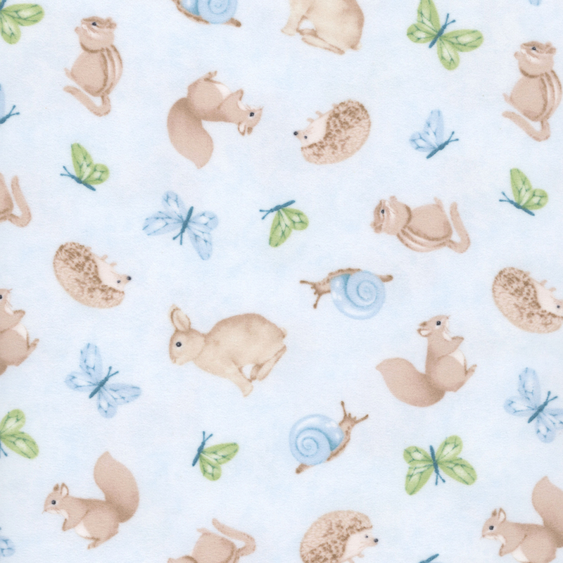 Mottled blue fabric with tossed forest animals like hedgehogs, squirrels, and chipmunks.