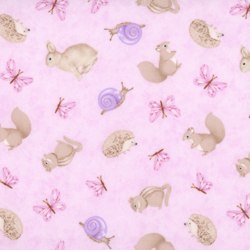 Mottled pink fabric with tossed forest animals like hedgehogs, squirrels, and chipmunks.