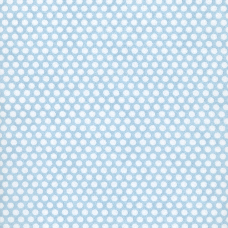Mottled blue fabric with neat rows of small white polka dots.