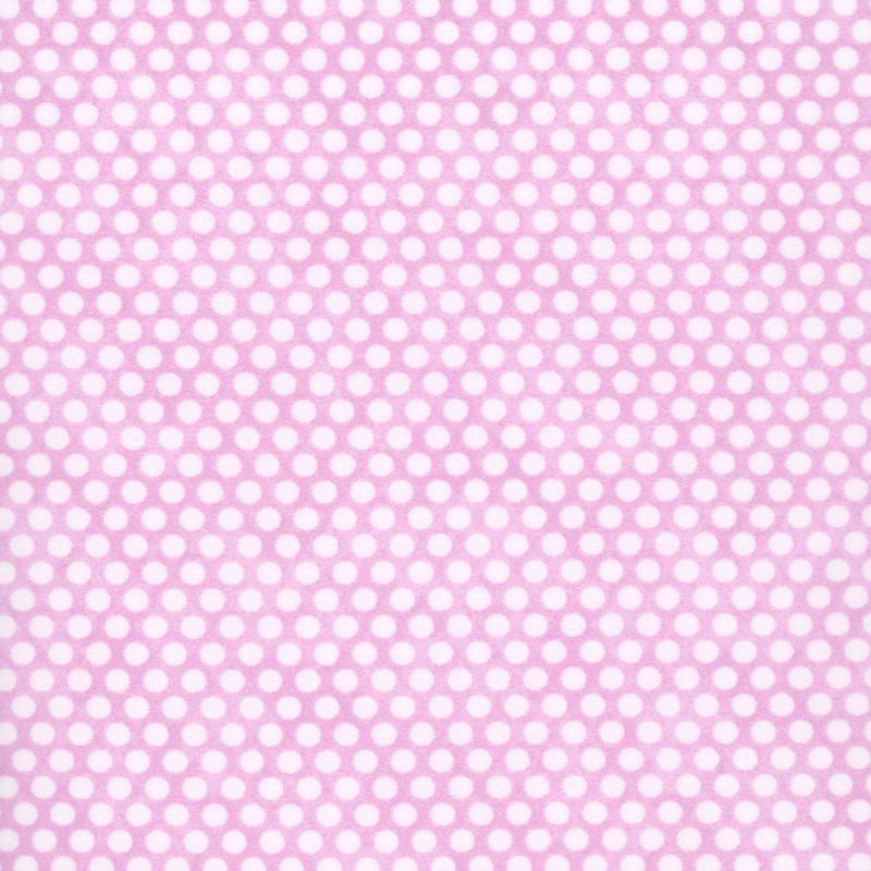 Mottled pink fabric with neat rows of small white polka dots.