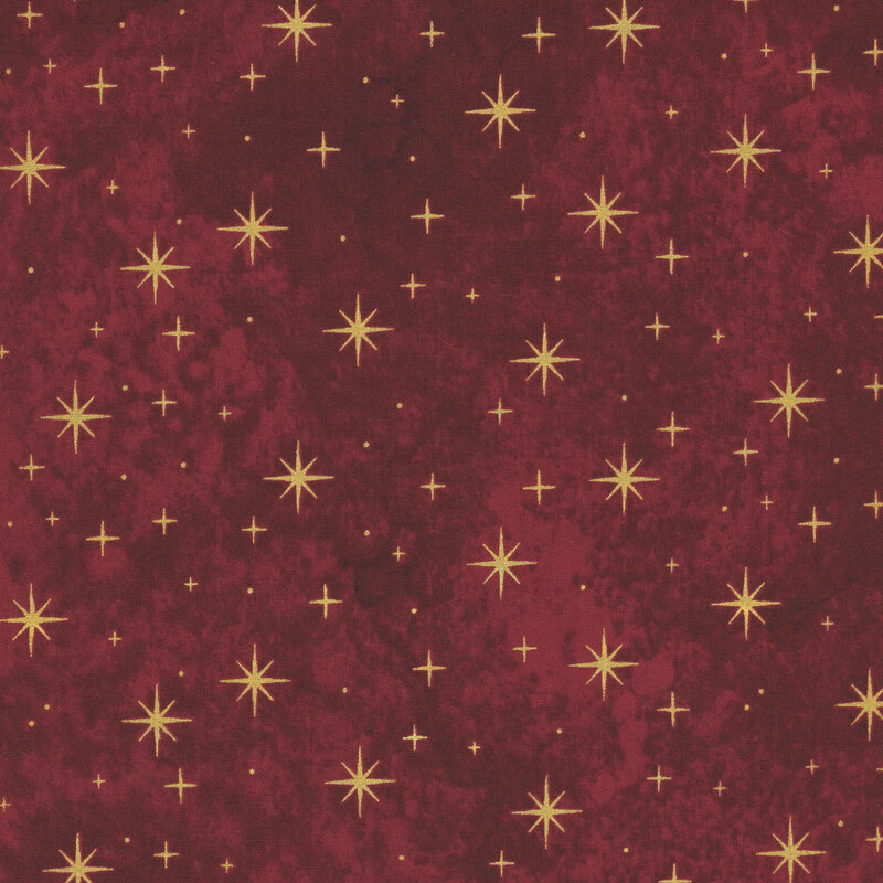 mottled burgundy fabric featuring gold metallic stars