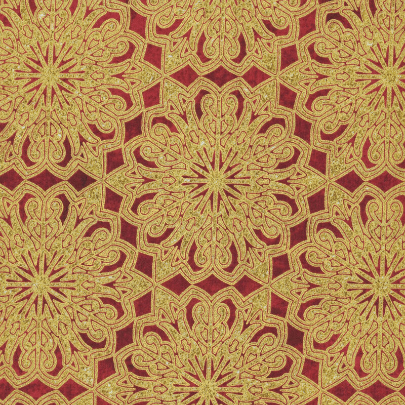 Mottled deep red fabric featuring large gold metallic ornamental snowflakes.