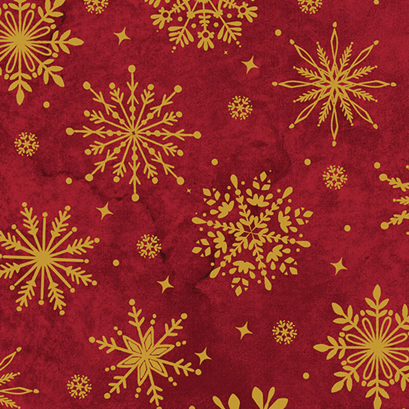 Mottled deep red fabric featuring gold metallic stylized snowflakes, dots, and stars.