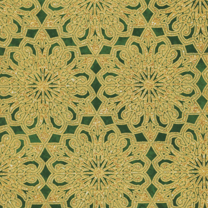 Mottled evergreen fabric featuring large gold metallic ornamental snowflakes.